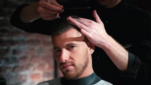 Barber Cuts the Hair of the Client with Scissors Close-up. Frame. Barber Combing Hair and Cutting