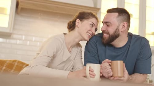 Romantic Couple Sharing Morning Coffee in Cozy Kitchen