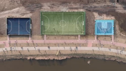 Soccer, football and basketball fields on sport playground in modern city district