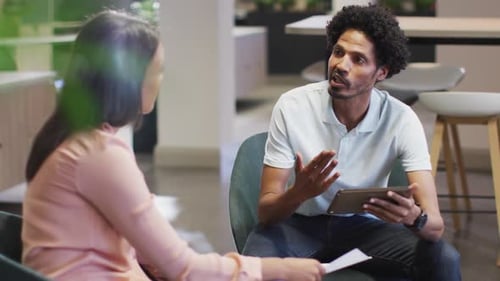 Business Colleagues Discussing Work in Modern Office