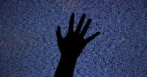 Hand Reaching Towards a Static Television Screen