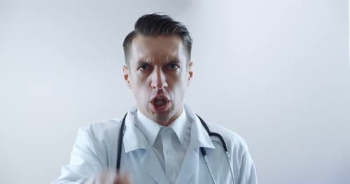 Angry Doctor Shouting and Pointing at the Camera
