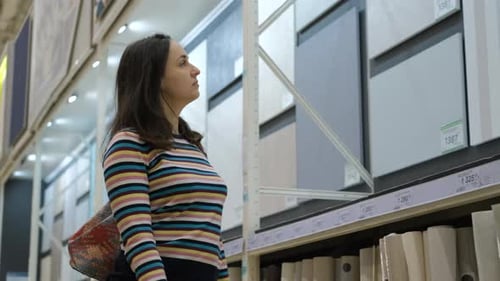 Young Adult Woman Shopping in a Big Box Store