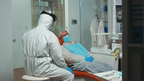 Dental Patient Prepared for Examination in Clinic