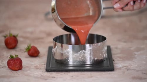 Preparing a Strawberry Dessert in the Kitchen