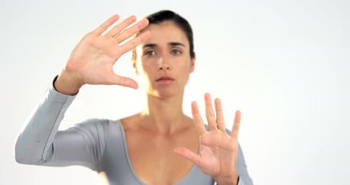Woman gesturing on white background