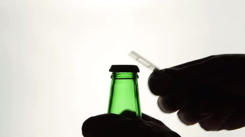 Hands Open Green Beer Bottle with Opener