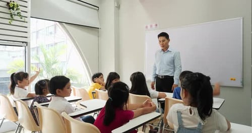 Teacher Interacting With Students in a Classroom Setting