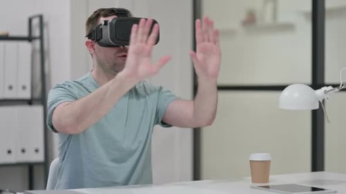 Man Using VR Headset in Modern Office