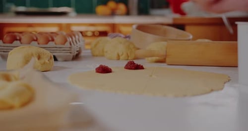 Preparing Dough with Jam Filling in Kitchen