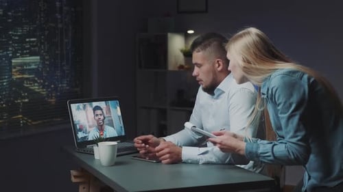 Young Adults on Video Call in Office at Night