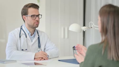 Doctor Consulting with Patient in Bright Office