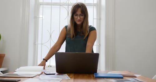 Millennial female professional working in a creative office