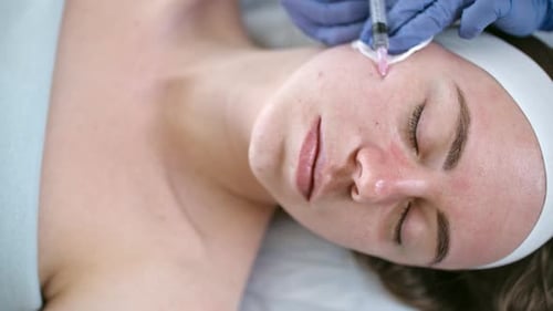 Woman Receives Facial Injection at Medical Spa