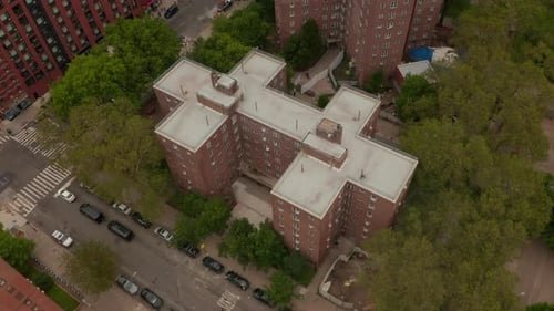 Birds View Flight Over Typical New York City Neighborhood Apartment Building with Garden