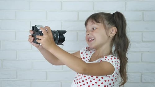Girl Takes Self Portrait Photograph with Digital Camera