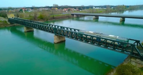 Train Crosses the Bridge Over a River