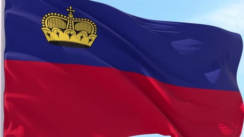 Waving Liechtenstein Flag Against Blue Sky