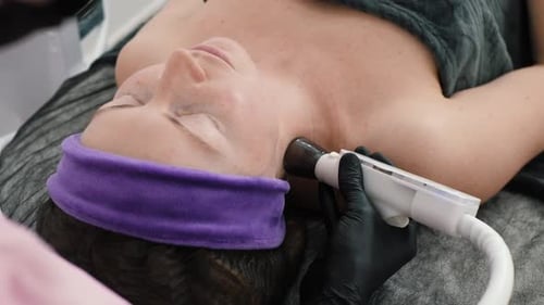 Woman Receives Beauty Treatment for Face and Neck