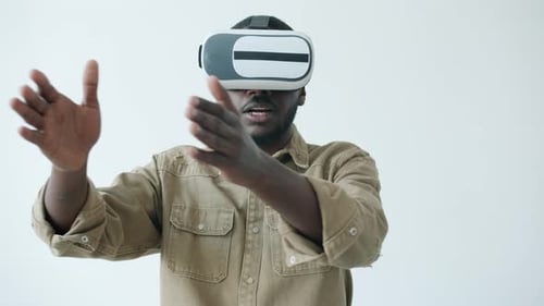 Man Wearing VR Headset Gesturing