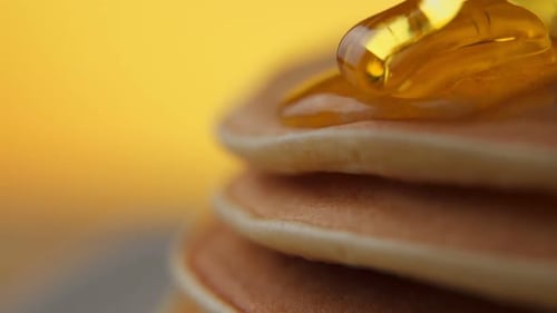 Pancakes Stacked High with Golden Syrup Drizzling