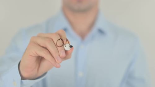 Man Writes "Online Banking" On Clear Surface
