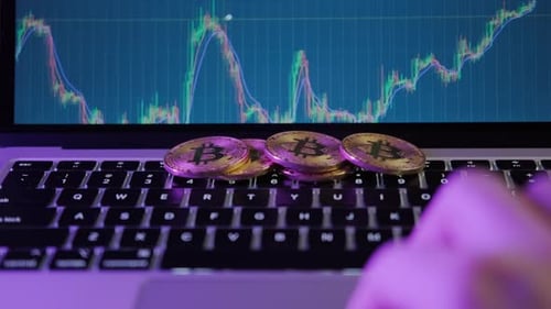 Bitcoin Cryptocurrency Trading with Financial Chart and Laptop