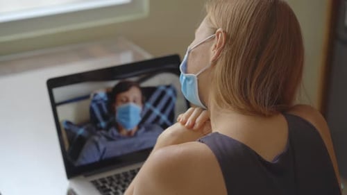 A Young Woman Talks Through Video Conferencing While She Is Sitting at Home During the Coronavirus