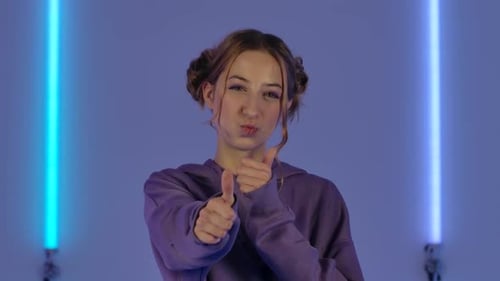 Enthusiastic Young Woman Gives Thumbs Up