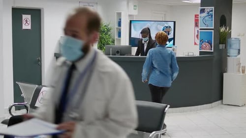 Multiethnic Group of People Sitting in Waiting Area During Covid 19 Pandemic