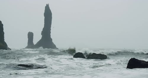 The Cliffs and Waves at the Black Sand Beach Reynisfjara in Vik Iceland