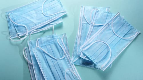 Stacks of Clean Blue Surgical Masks for Protection