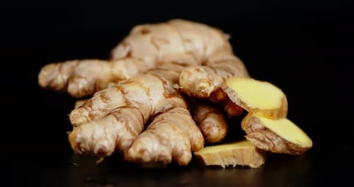 Fresh Ginger Root and Slices Close Up