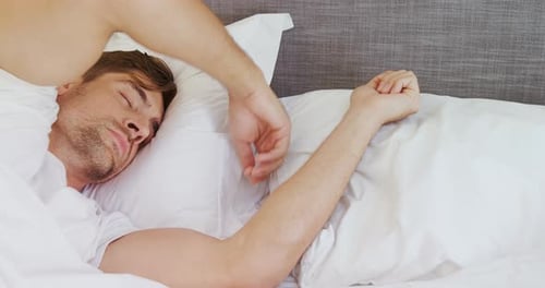 Young man sleeping on bed in the bedroom 4K 4k
