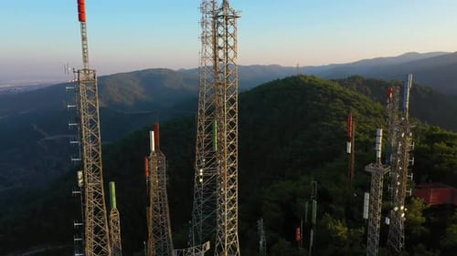 Telecommunication Towers on Hillside Aerial Shot