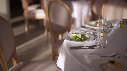 Tables Set Elegantly at a Restaurant for Dinner