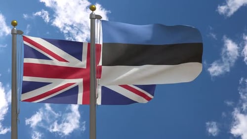 Flags of United Kingdom and Estonia Waving in Blue Sky