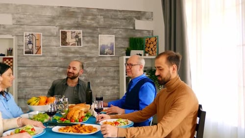 Family Meal Together in Bright Home Dining Room