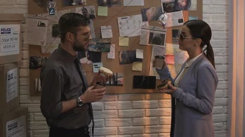 Detectives Eating Donuts and Discussing a Case