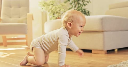 Adorable Baby Crawling Towards Toys in Bright Home