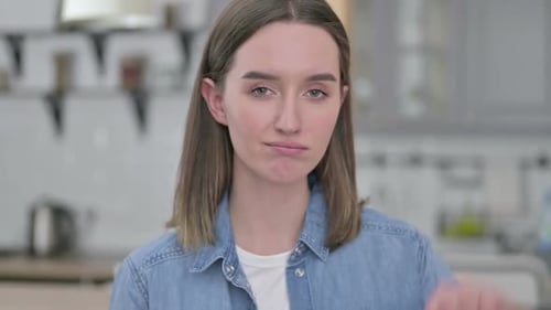 Woman Gives Thumbs Down Gesture Close Up