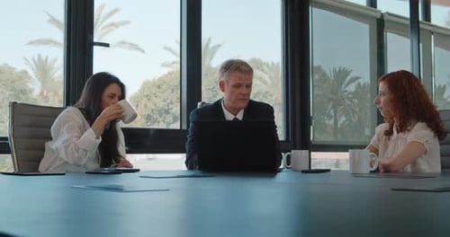Business Team Discussing Strategy in a Conference Room