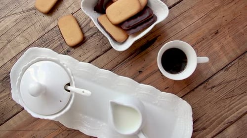 Small coffee cup on a wooden table top view