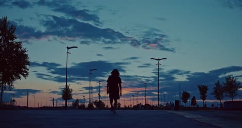 Confident Black Man Walking Against Beautiful Summer Sunset in City Dark Silhouette Prores