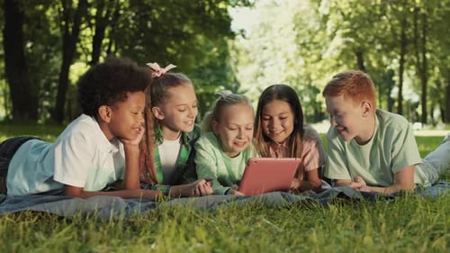 School Kids Using Tablet and Smiling