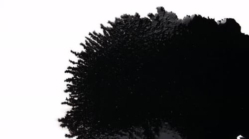 Expanding Black Ink Blot on White Background