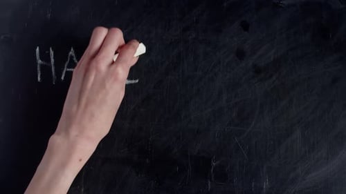 Halloween Party Written on Dirty Chalkboard