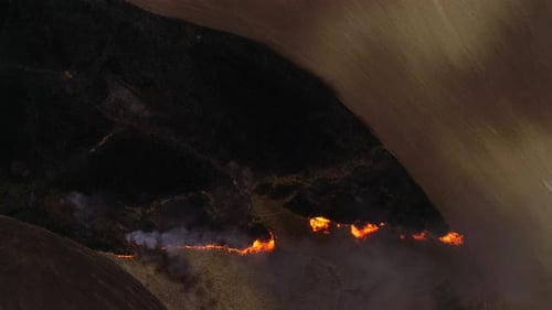 Aerial View of Spreading Wildfire Flames