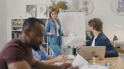 Team Discusses Data in Modern Office