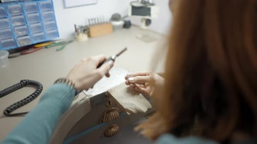 Jeweler Working on Jewelry with Precision Drill